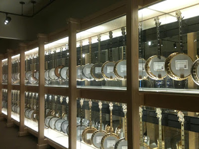 A display case with many vintage banjos at the Banjo Hall of Fame